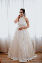 Elegant Pearl White Halter-Neck Satin Gown with Lace Bodice